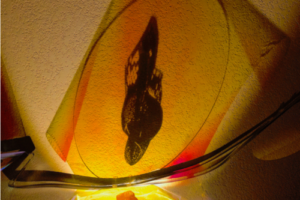 Ner Tamid (Black Flame In Yellow), 2020, Radiant Film/Silhouette/Acrylic Disc/Metal Strapping, 36inHx36inWx12inD